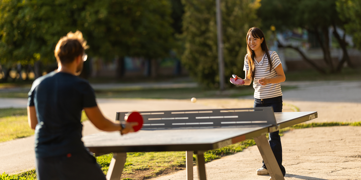 Outdoor table tennis game in progress