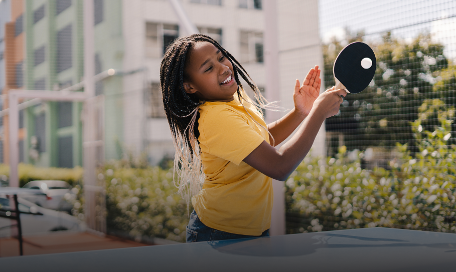 Young girl enjoying ping pong game