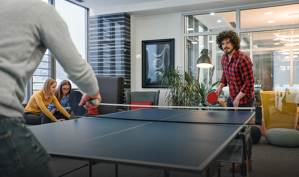 Office ping pong game in progress