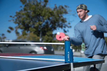 Table tennis game in action