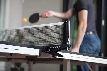 Player hitting ping pong ball