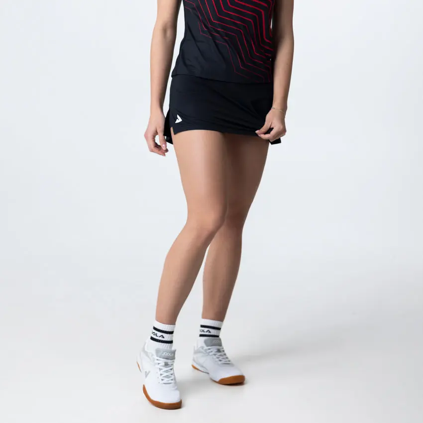 Female athlete posing in sports attire
