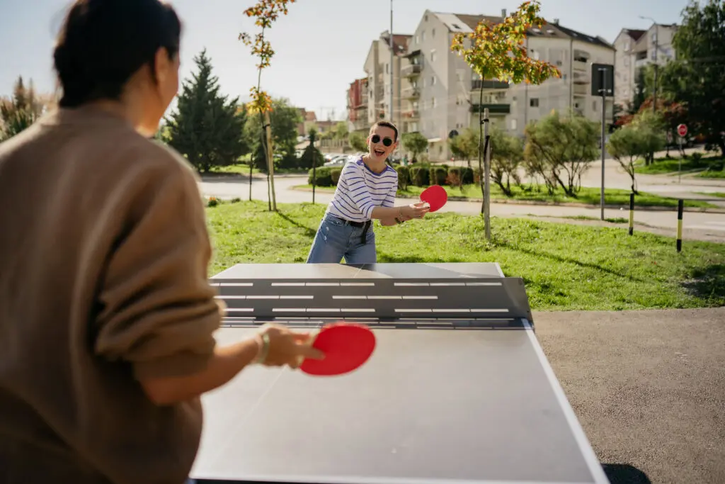 Friends enjoying a table tennis game