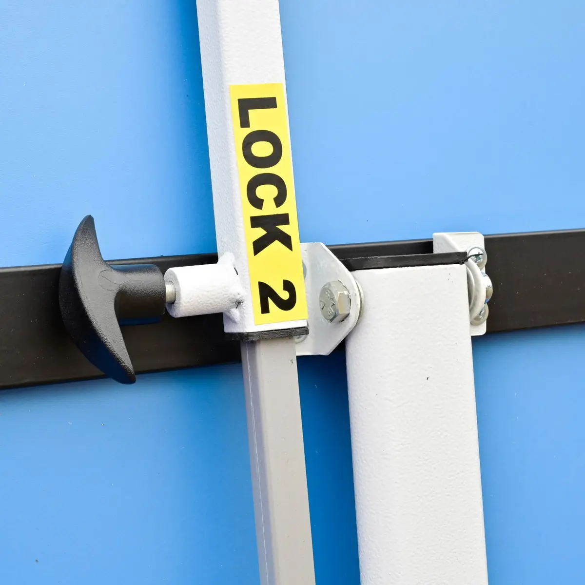 Locking mechanism with handle on blue background.