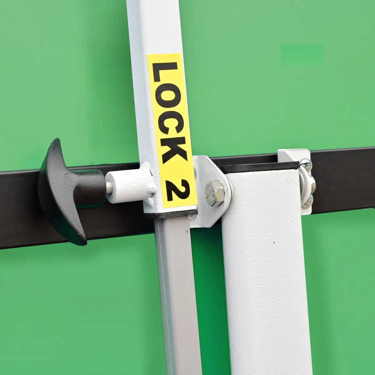 Lock mechanism on green metal door
